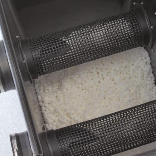 Inside view of the Oase ProfiClear Premium Moving Bed Module L, showing Hel-X biomedia for efficient ammonia and nitrite breakdown.