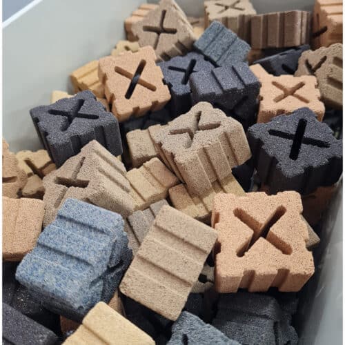Burtons bio block ceramic filter media randomly placed inside a Bakki shower filtration tray