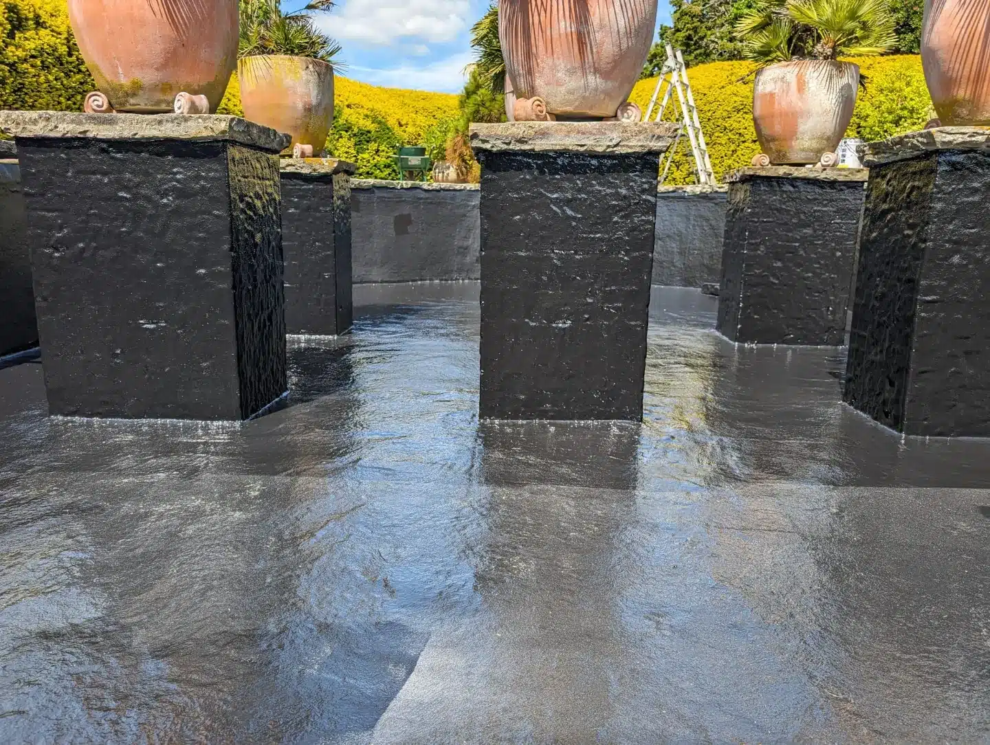 Custom large koi pond with smooth fibreglass coating in London Custom large koi pond with smooth fibreglass coating completed by That Pond Guy in London, providing a watertight, durable, and long-lasting pond solution.