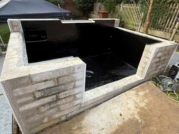 Fibreglass pond enhancement for improved aesthetics completed by That Pond Guy in Kent, ensuring a watertight, durable, and visually stunning pond.