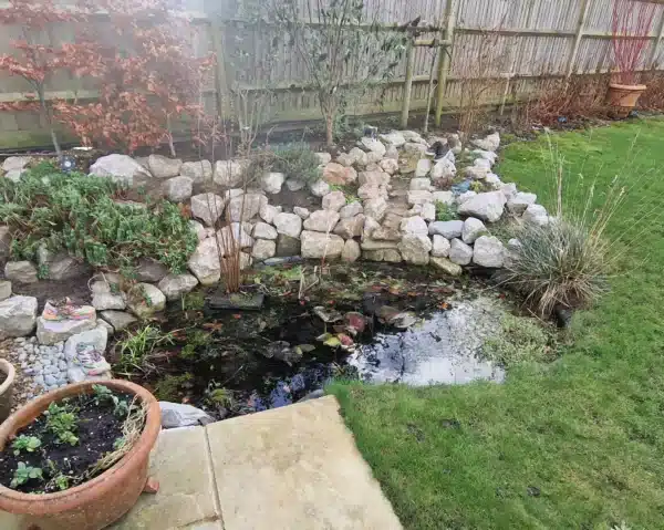 Pond before professional cleaning showing algae sludge and murky water in Kent