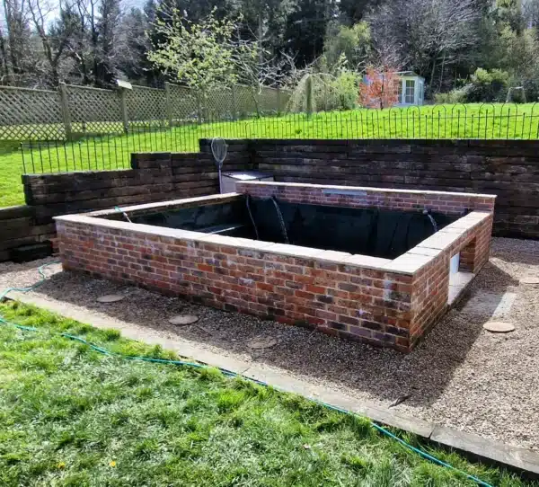 Clean pond after deep cleaning with clear water in Canterbury, Kent