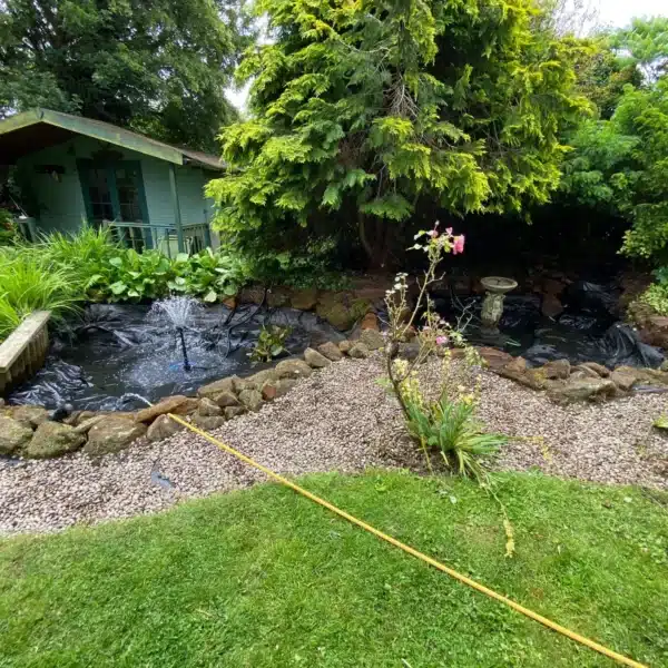 Restored pond after deep cleaning with clear water in West Sussex