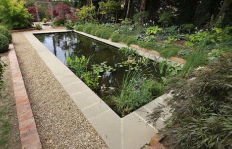 Pond fully relined with new liner and finished with new paving