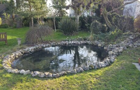 Finished pond after liner to fibreglass conversion filled with water