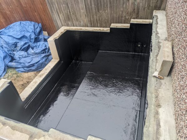 Fibreglass lined koi pond in Buckinghamshire with smooth non porous GRP surface