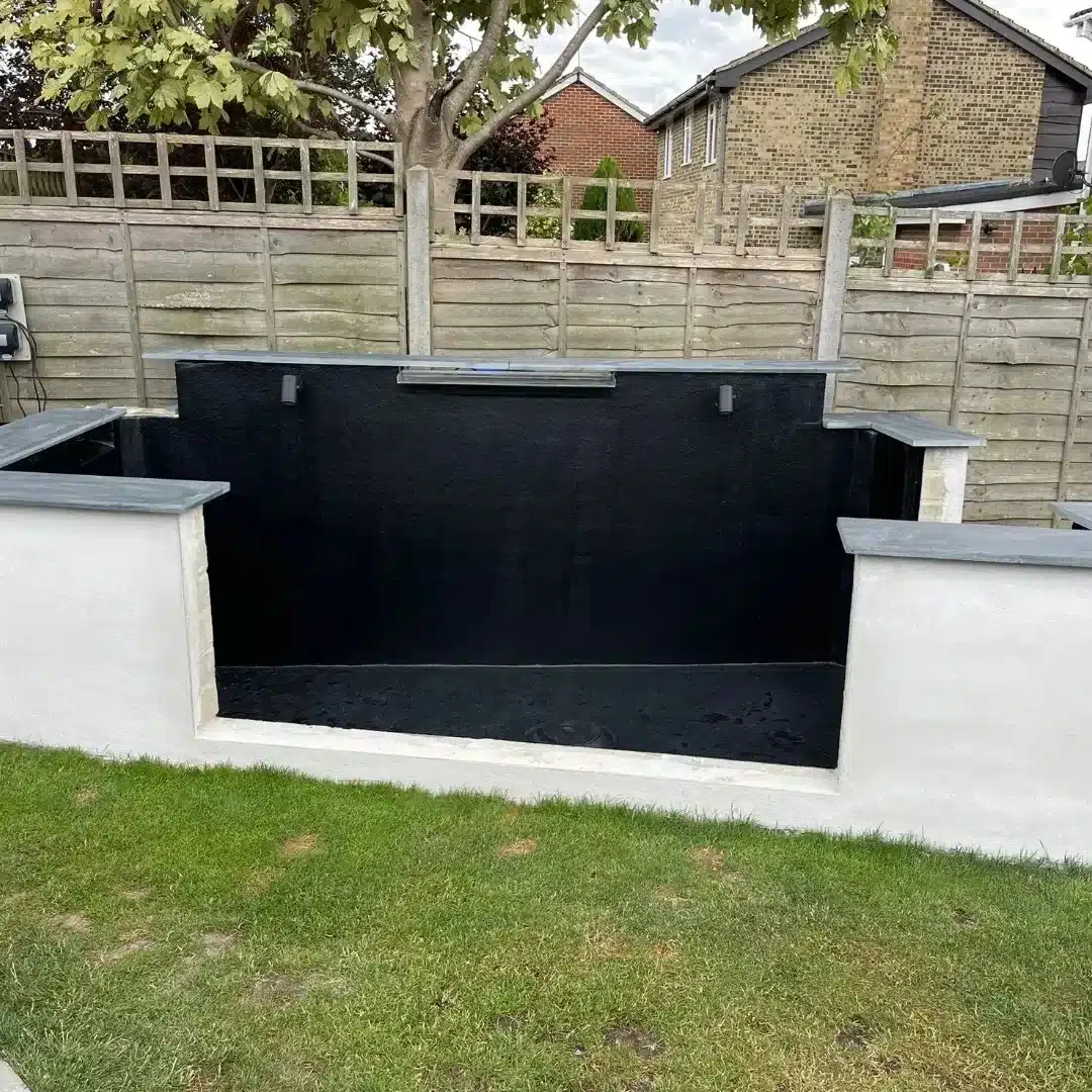 Completed fibreglass pond lining in Sussex with smooth blue GRP finish