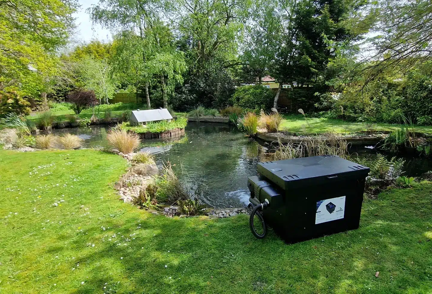 Oase ScreenMatic 145000 installed beside a garden pond
