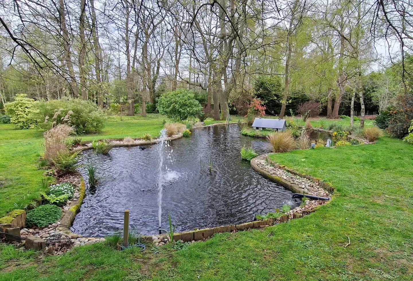 The same garden pond filled with water in our ScreenMatic 145000 installation photographs