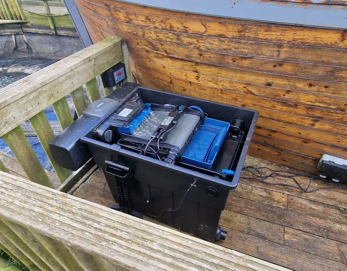 Open Oase ScreenMatic 90000 with its screen assembly and debris tray visible